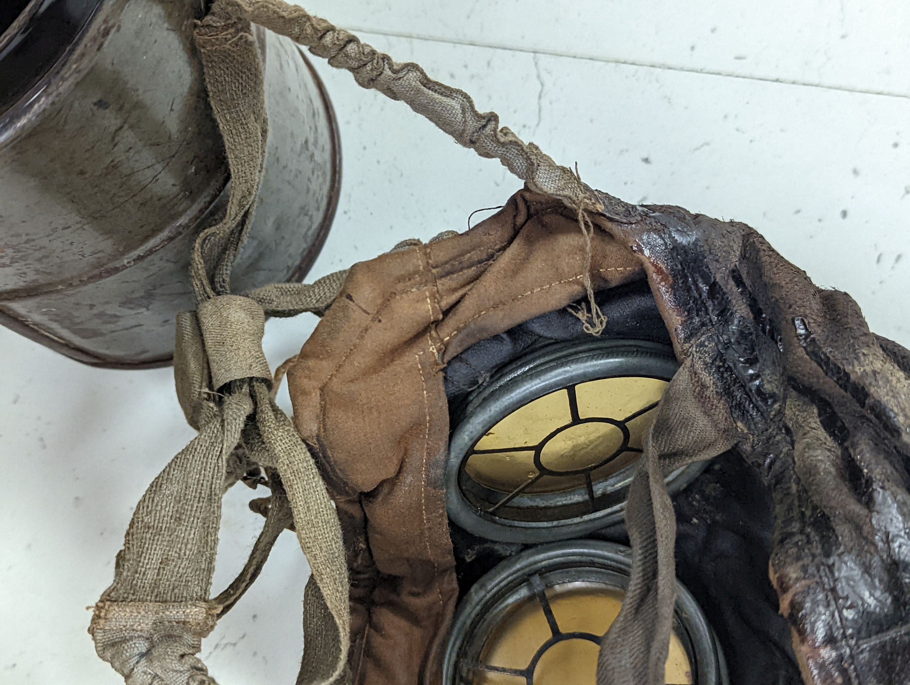 WWI German gas mask, two German trench mess tins and a German leather belt case